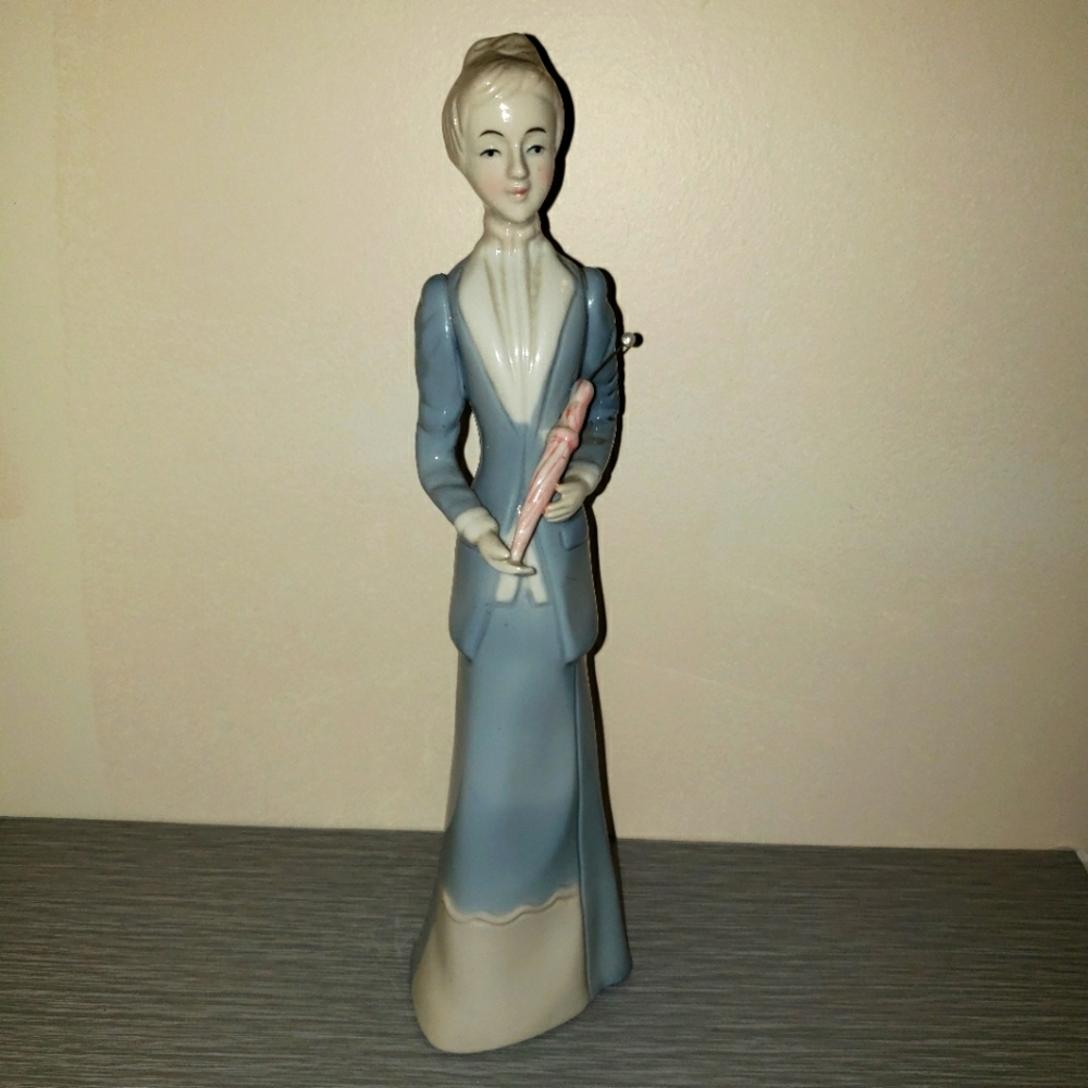 Elegant Figurine of Woman with Umbrella